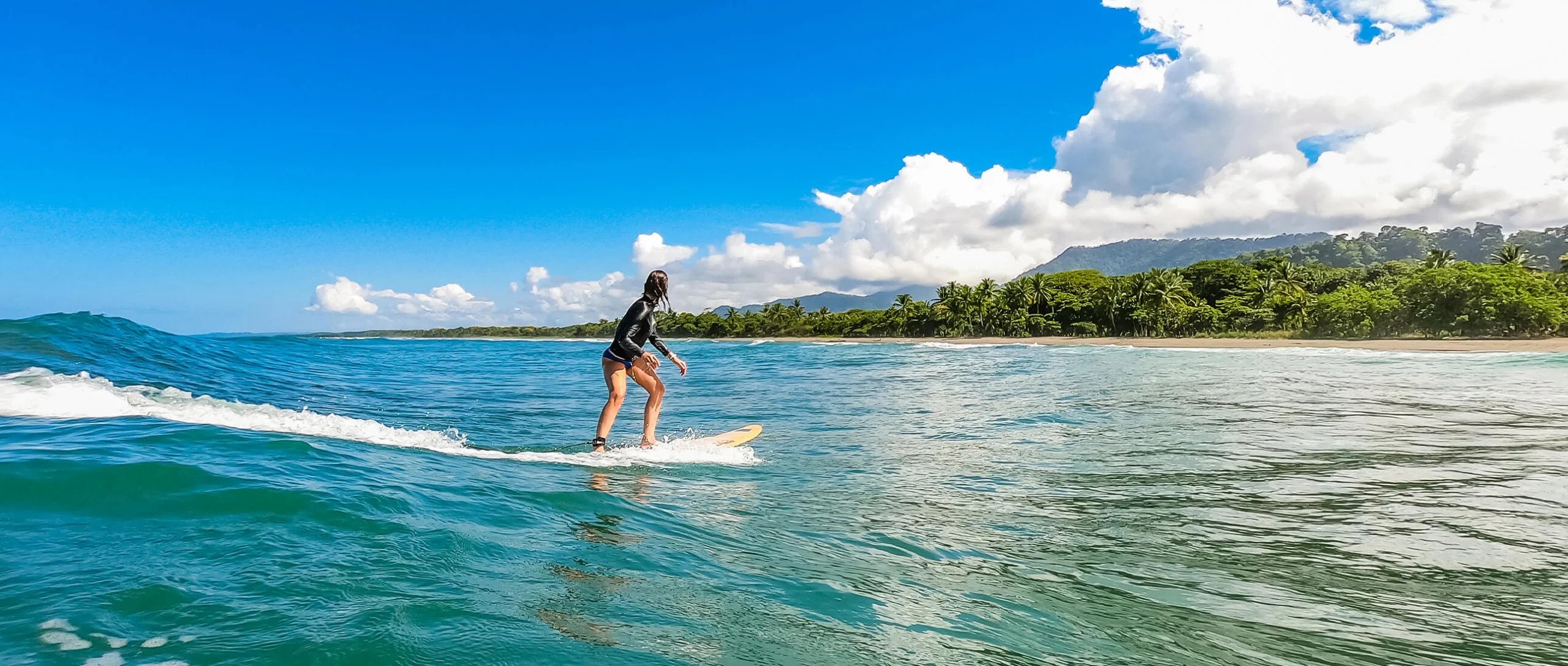 go pro photo of playa linda with surfer in costa rica