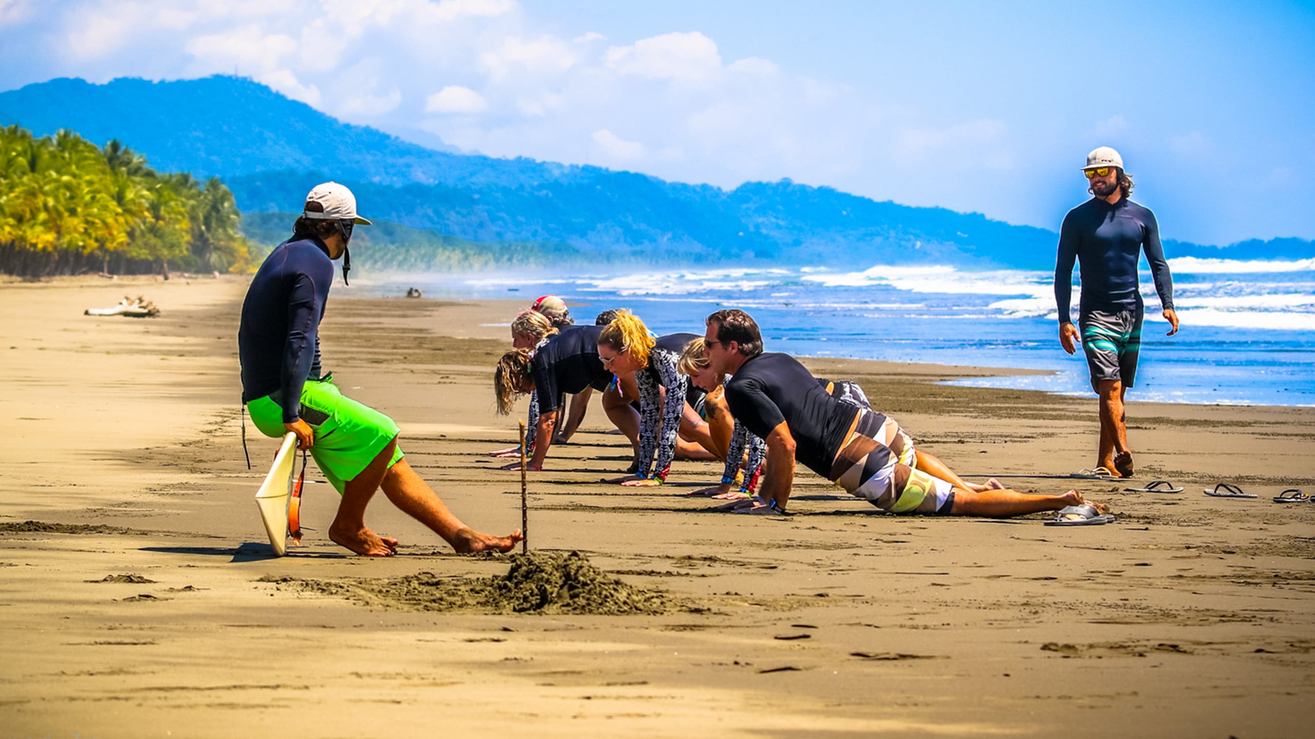 surf coaches learn to surf at beach in playa linda