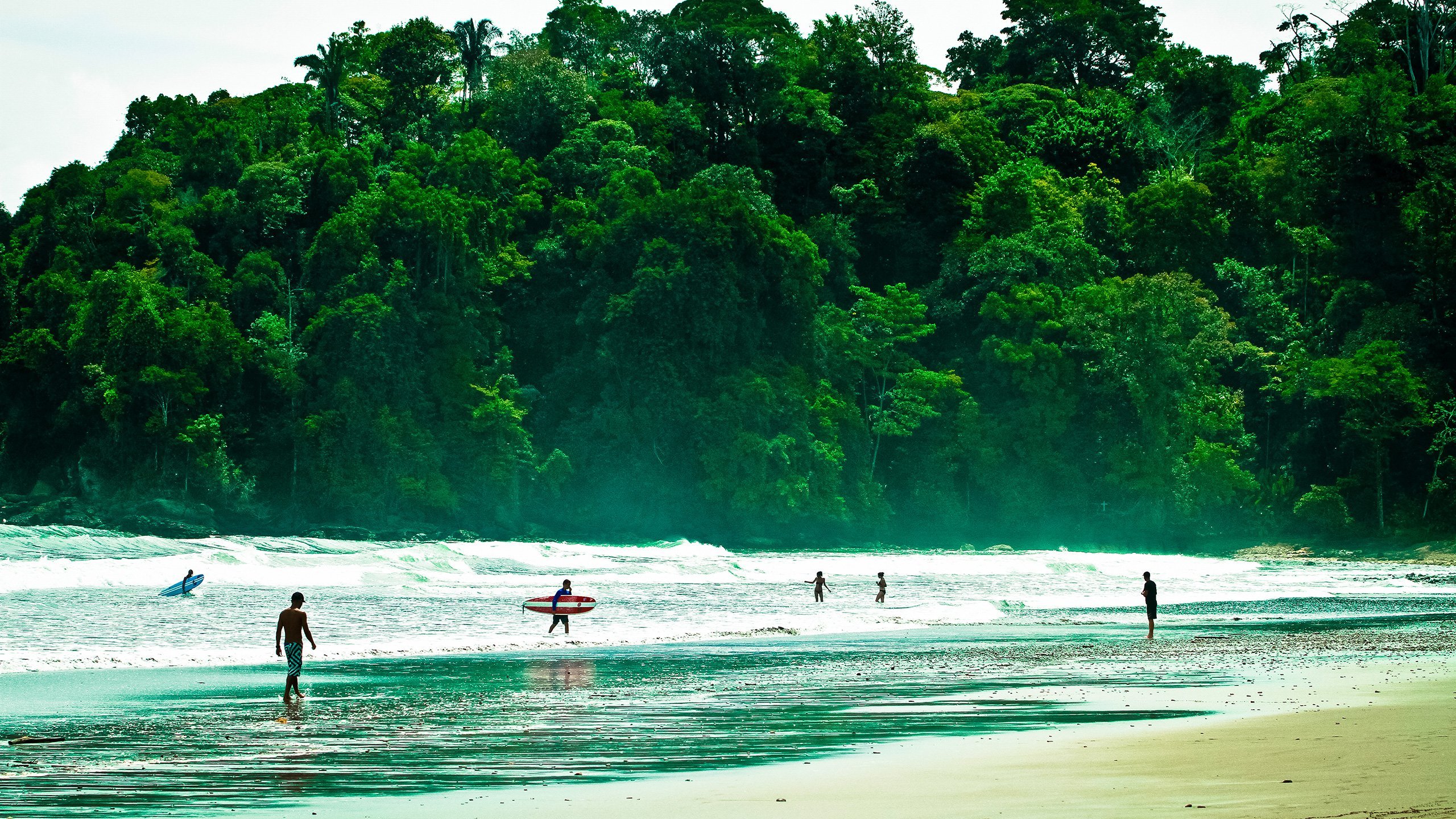 playa hermosa photo with surfers leaving the water