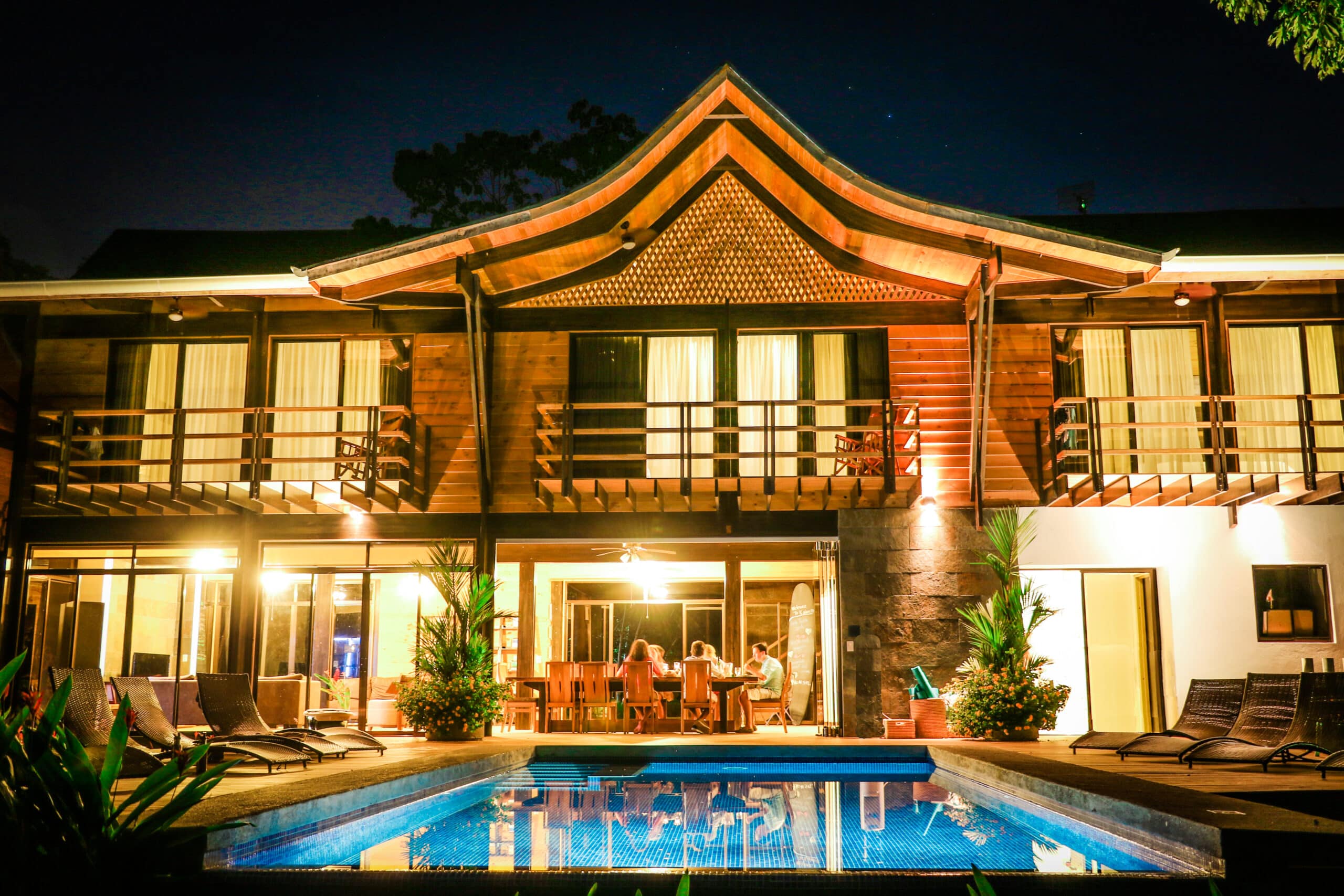 guests dining by night shot at Kalon Surf resort
